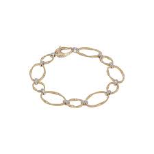 Marco Bicego 18K Yellow Gold  Marrakech Onde Diamond Flat Link Bracelet 
Diamonds total carat weight:  0.18ctw
Length: 7.5 Inch