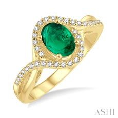 14 Karat Yellow Gold 7 X 5 Oval Emerald And 0.20 Ct Diamond Halo Twist Ring