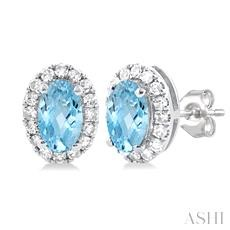 10 Karat White Gold Oval 5 x 3 Aquamarine And 0.13 ct Diamond Halo Stud Earrings