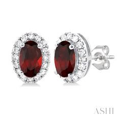 14 Karat White Gold Oval 5 x 3 Garnet And 0.13 ct Diamond Halo Stud Earrings