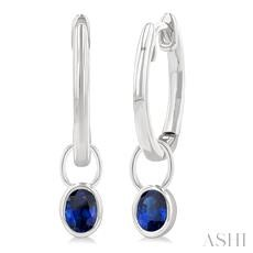 14 Karat White Gold 5 X 3 Oval Sapphire Bezel Set Huggie Earrings