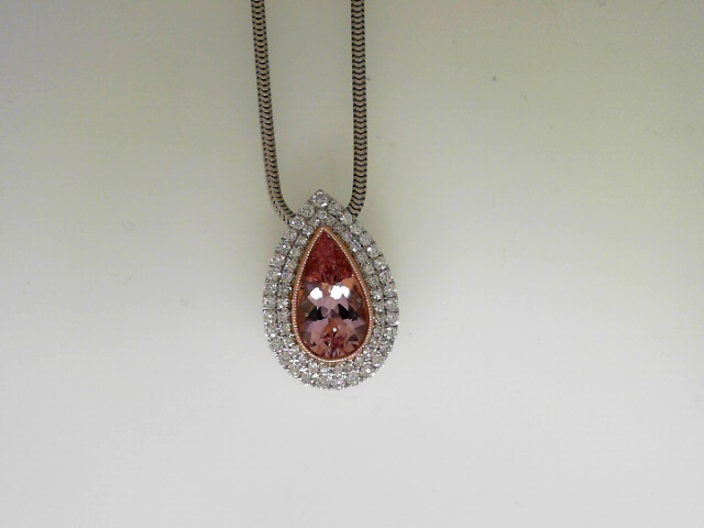 14 Karat White / Rose Gold  ESTATE Morganite  Pendant With 0.50Tw Round Diamonds
Snake is 18 inches  and weighs 2.7 dwt, 1.4 mm in width

11x7 mm  Morganite
32 diamonds .01 each
32 diamonds .005 each
4.8 grams
Very Good Condition

Please Keep In