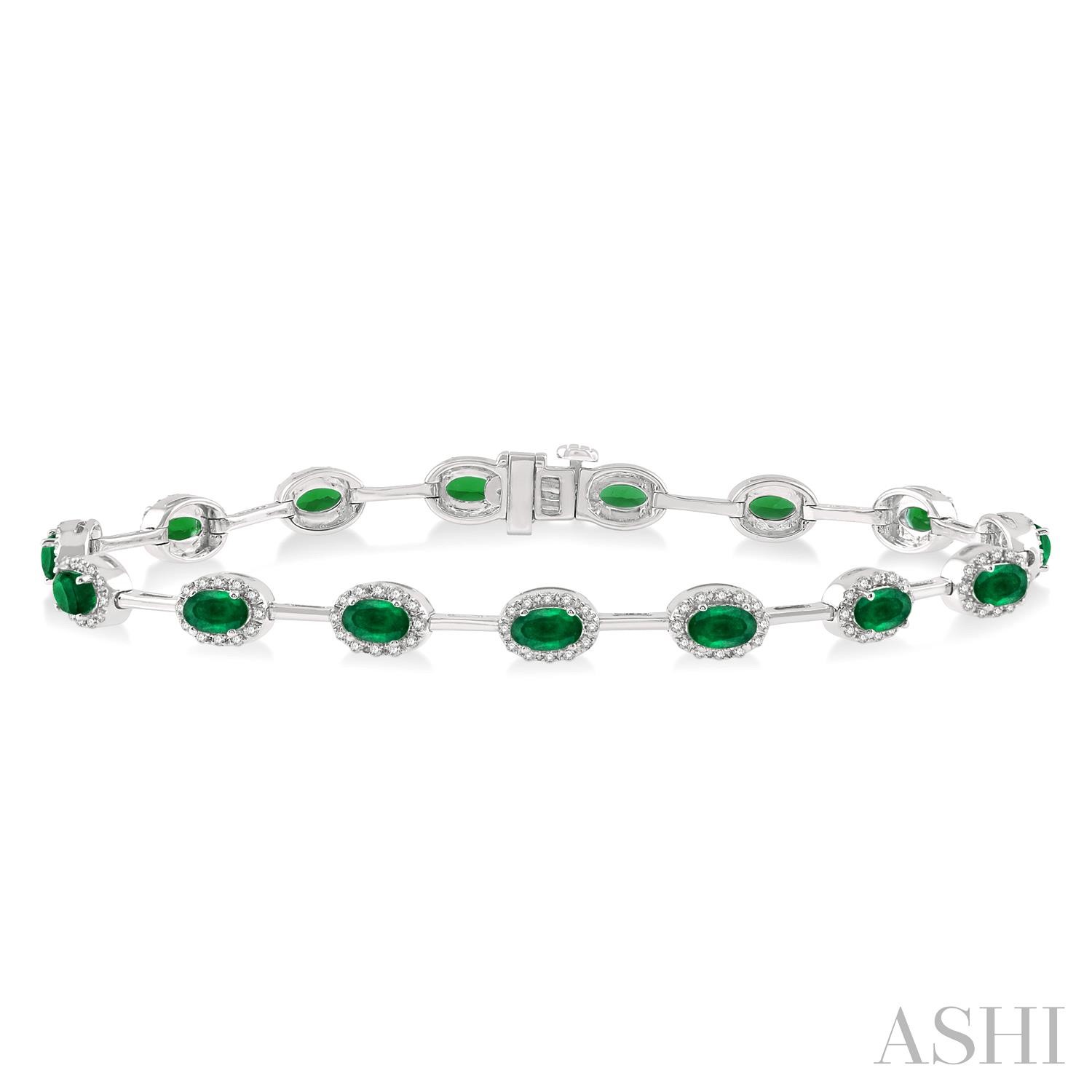 14 Karat White Gold 5x3 Oval Emerald Cut And 0.65 ct Diamond Halo Link Bracelet 7 Inch