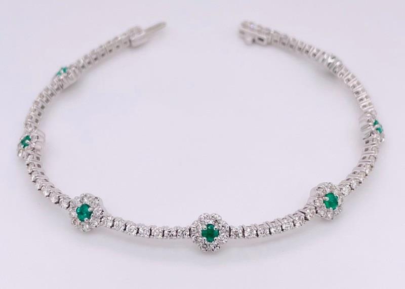 14 Karat White Gold Flower StationTennis Bracelet Bracelet With 7=0.48Tw Round Emeralds And 2.75Tw Round Diamonds  
Length: 7