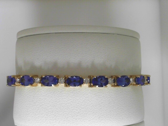 14 Karat Yellow Gold ESTATE  Bracelet With 20=10.00Tw Oval Tanzanites And 20=0.80Tw Round Diamonds

Please Keep In Mind That When Buying Estate Items You Are Purchasing Something That Is Pre-Loved.  Most Estate Items Show Signs Of Wear, But That Is Also