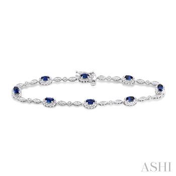 14 Karat White Gold 5X3 Oval Sapphire And Diamond 0.05 Ct Bracelet 7 inch