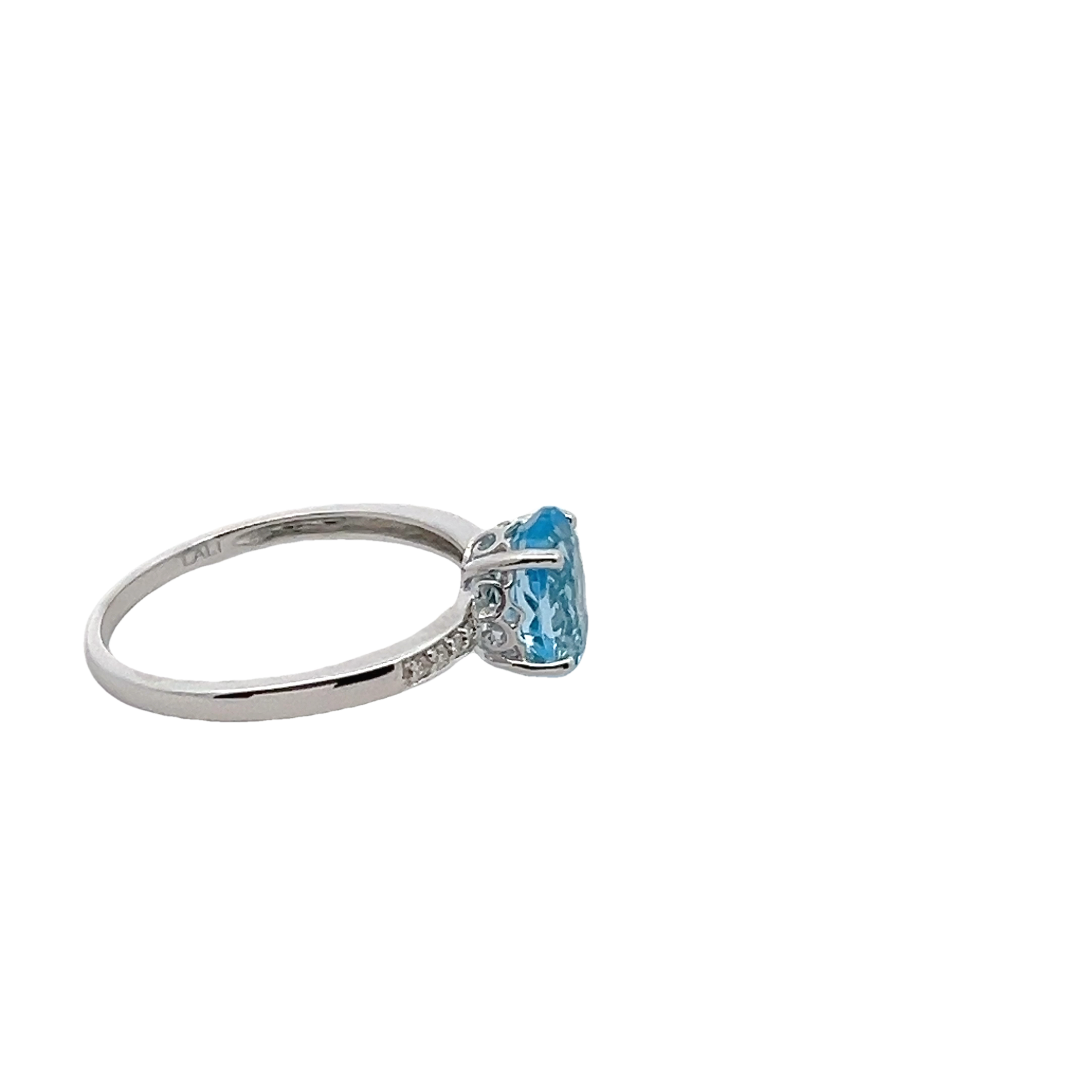 14k White Gold Diamond And Blue Topaz Ring