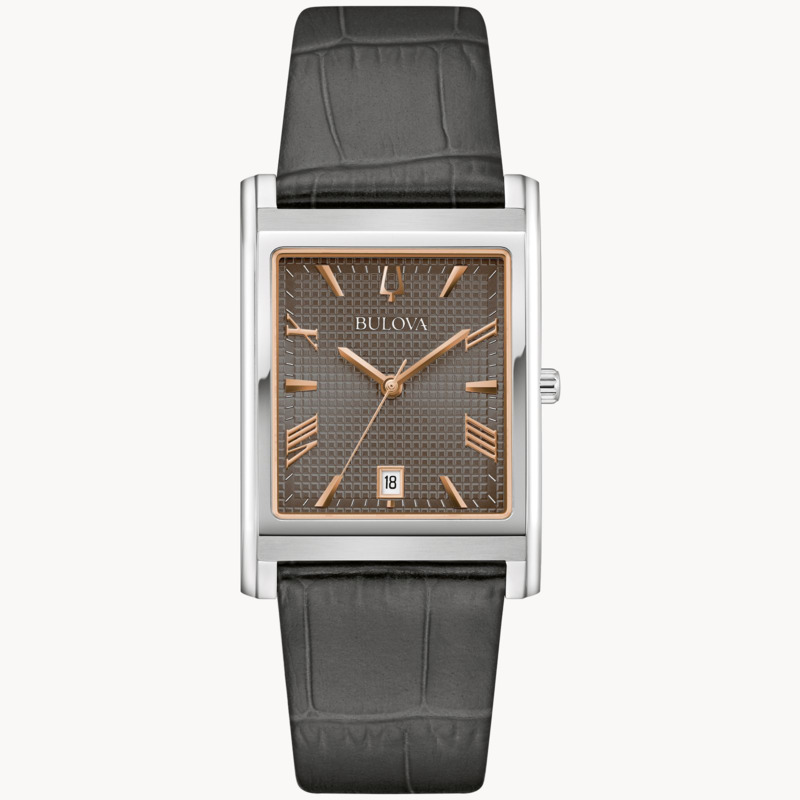 GENTS BULOVA CLASSIC WATCH STAINLESS STEEL CASE  GRAY TEXTURED DIAL WITH ROSE TONE ACCENTS AND GRAY LEATHER STRAP