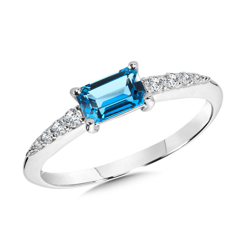 14K WHITE GOLD RING SIZE 7 WITH ONE 0.68CT BAGUETTE BLUE TOPAZ AND 8=0.10TW ROUND G-H I1 DIAMONDS  (1.54 GRAMS)