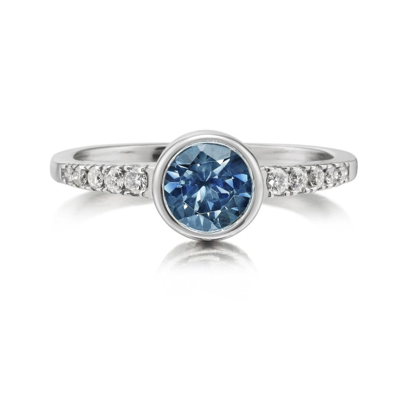 14K WHITE GOLD BEZEL RING SIZE 6.5 WITH ONE = 0.97CT ROUND MONTANA SAPPHIRE AND 10 = 0.15TW ROUND H-I SI2 DIAMONDS   (2.64 GRAMS)