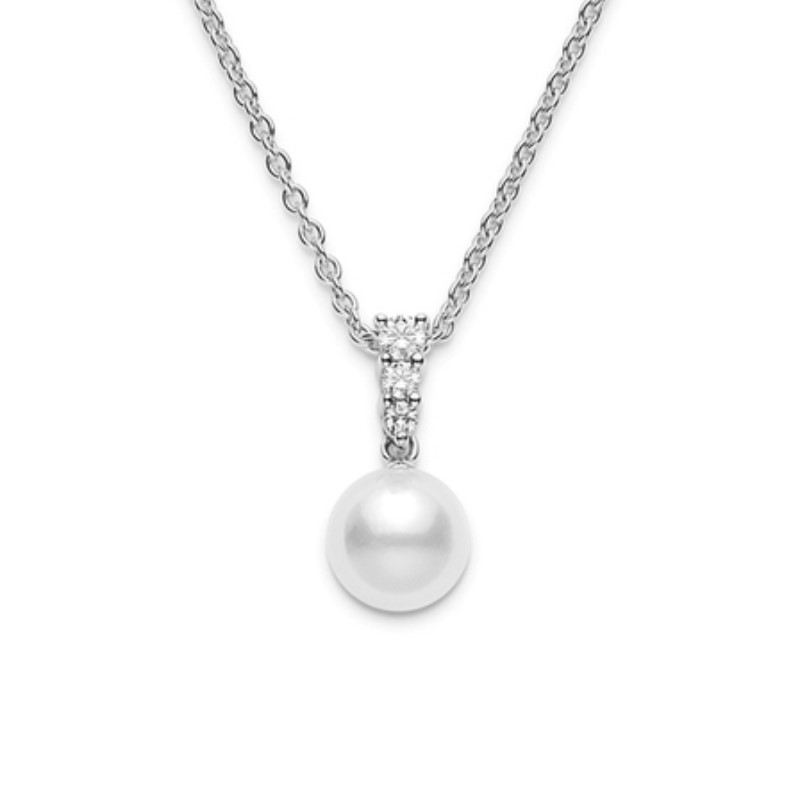 Mikimoto Morning Dew Akoya Pearl And Diamond Pendant  The 18 karat white gold pendant contains 3 full cut diamonds prong set in the bail with 1 white pearl measuring 8 mm and A+ in quality