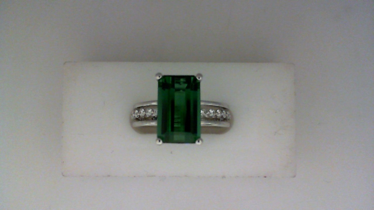 14K WHITE GOLD RING WITH A 3.71CT EMERALD CUT TOURMALINE WITH .22CTTW ROUND VS CLARITY & G COLOR DIAMONDS SET DOWN THE CENTER OF THE OPEN SHANK